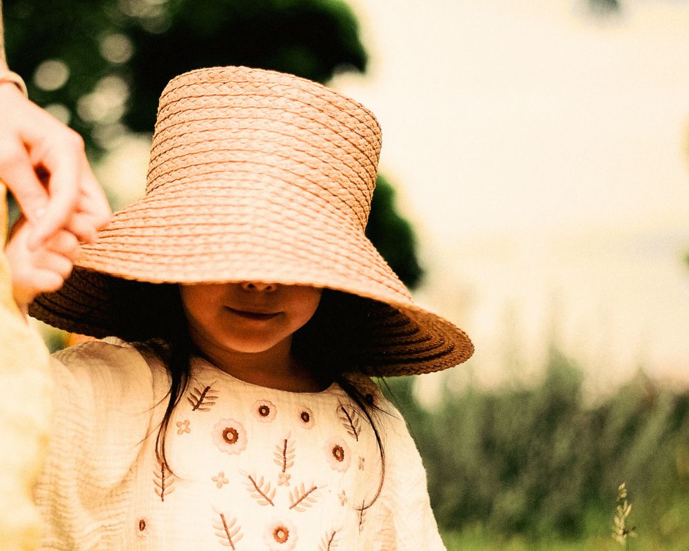 young girl in sun hat